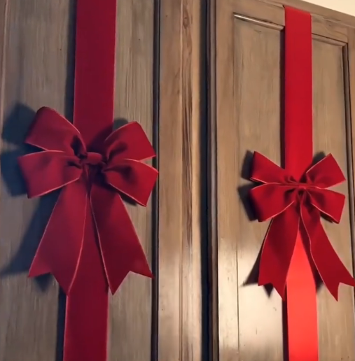Velvet bows attached to wood cabinet doors